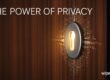 A highly detailed close-up of a solid wood door featuring a glowing, digital keyhole emitting tech-like light rays, with the text "THE POWER OF PRIVACY" and the Wiperts.com logo, representing strong internet security and data protection.